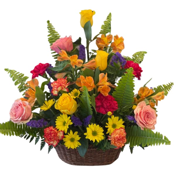 Colorful flower arrangement in a wicker basket with roses and daisies