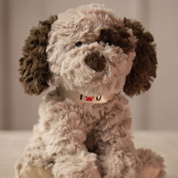 Plush dog toy with shaggy brown and cream fur