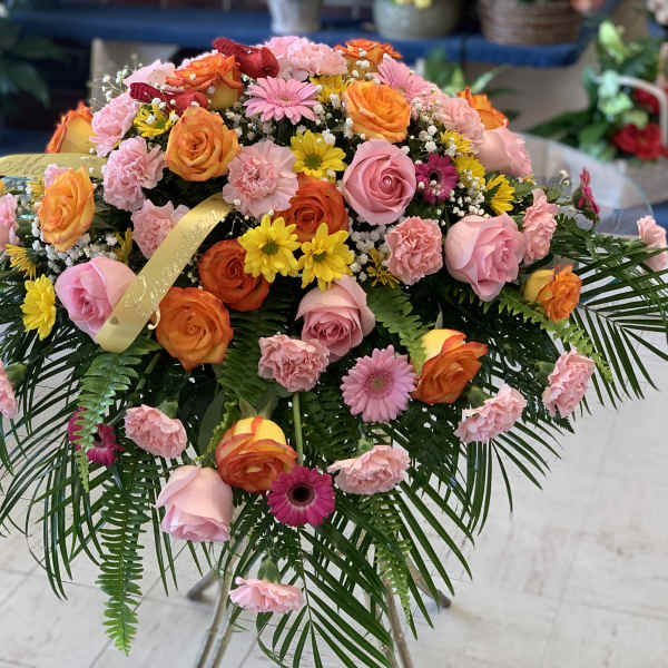 Large mixed bouquet of pink, orange, and yellow flowers