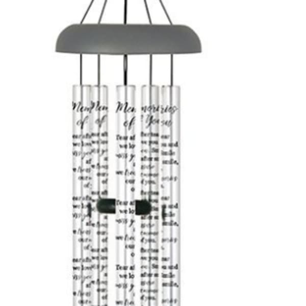 Hanging metal wind chime with silver tubes and a dark clapper