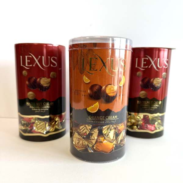 Three Lexus chocolate gift tins on a white surface