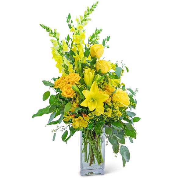 Yellow floral arrangement in a clear glass vase