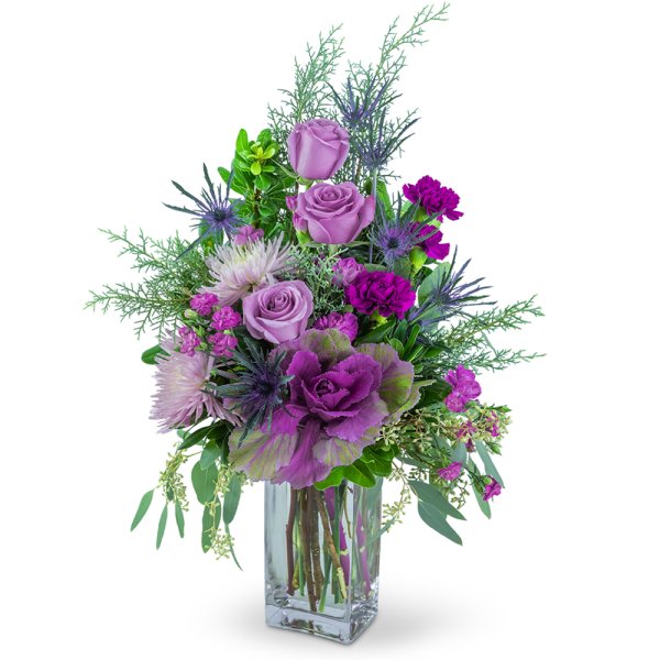 Purple and pink floral arrangement in a clear glass vase