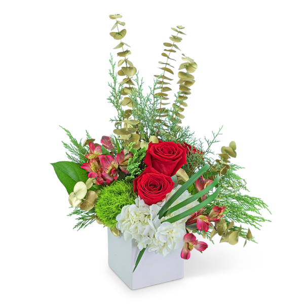 Red roses and white hydrangeas in a white box with mixed greenery