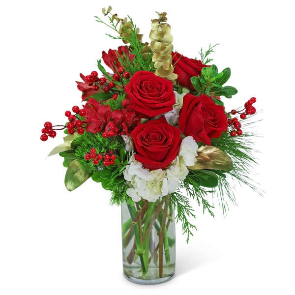 Red roses and white flowers in a clear glass vase