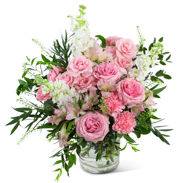Pink roses and carnations in a clear glass vase