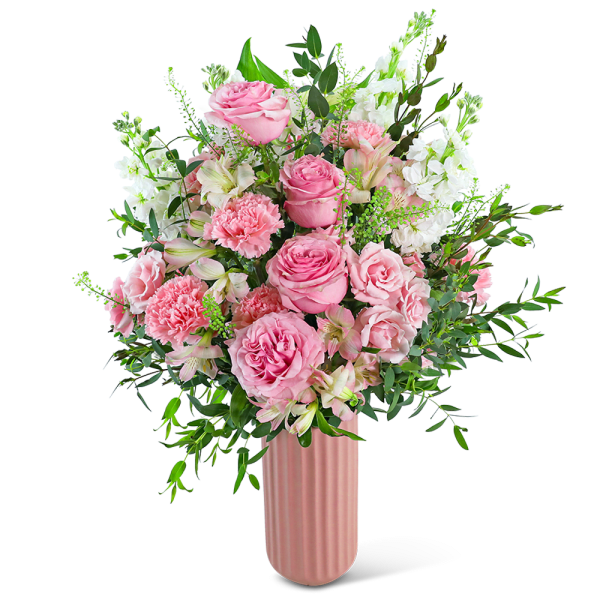 Pink roses and carnations in a tall pink vase