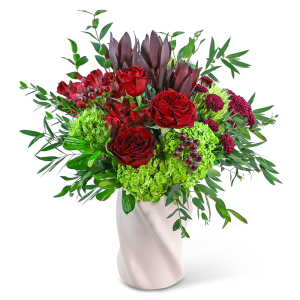 Red roses and green hydrangeas in a white vase