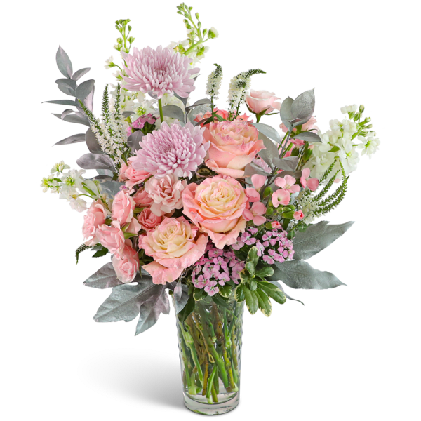 Pink and peach bouquet in a clear glass vase