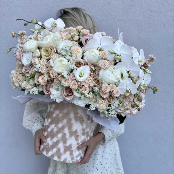 Large pastel bouquet with white orchids and blush roses