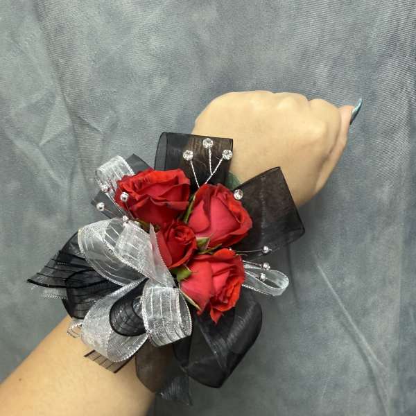 Red spray roses black silver corsage