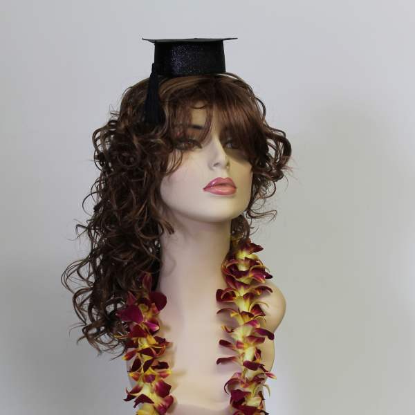 Mannequin wearing a graduation cap and orchid lei