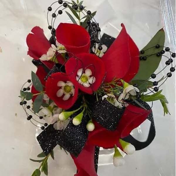 Red calla lily bouquet with black berry accents and ribbon