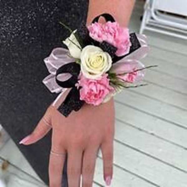 Pink and white floral wrist corsage with ribbon
