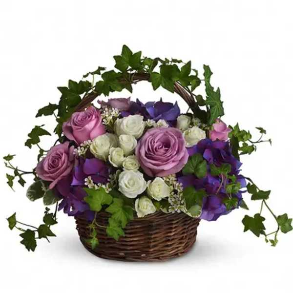 Basket of pink, white, and purple roses with ivy