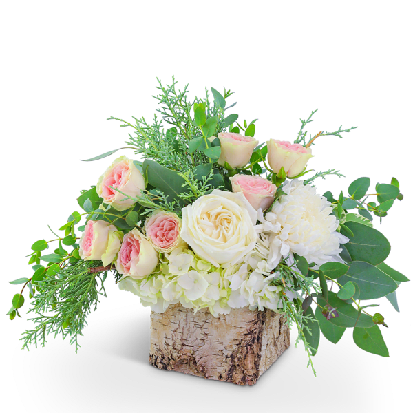 Pink and white roses in a birch bark container