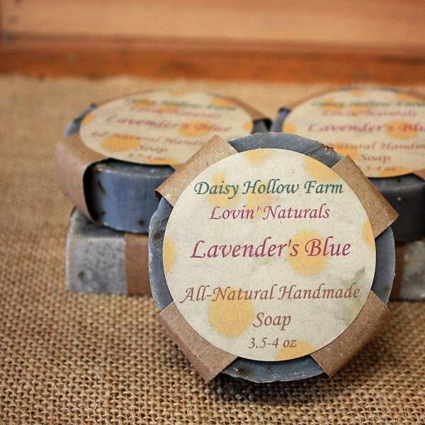 Three bars of lavender-blue handmade soap with paper labels