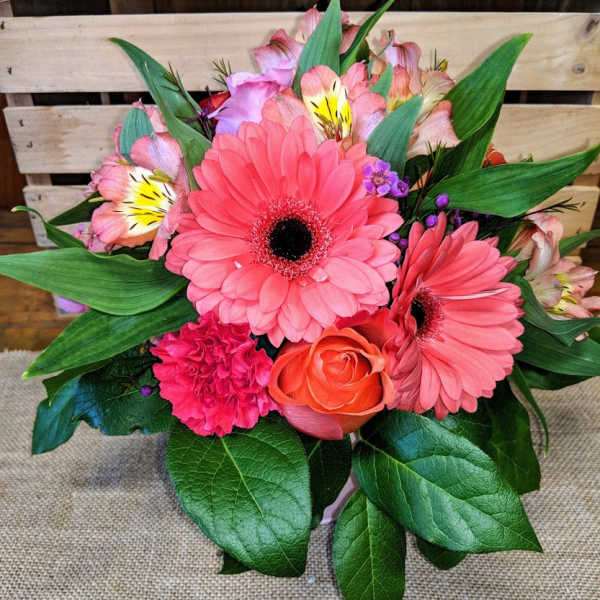 Pink gerbera daisy bouquet with an orange rose and mixed blooms