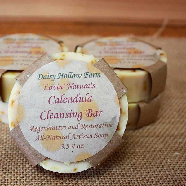 Three labeled calendula cleansing soap bars on burlap
