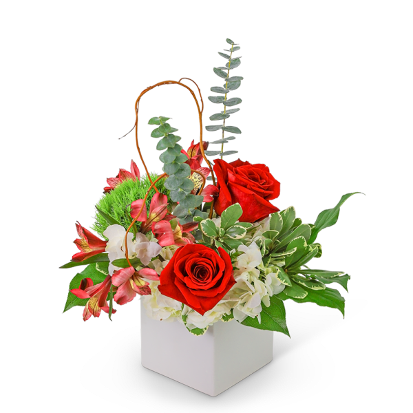 Red roses and white flowers in a white box with greenery