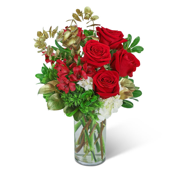 Red roses and red alstroemeria in a clear glass vase
