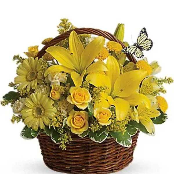 Yellow floral basket arrangement with lilies and roses