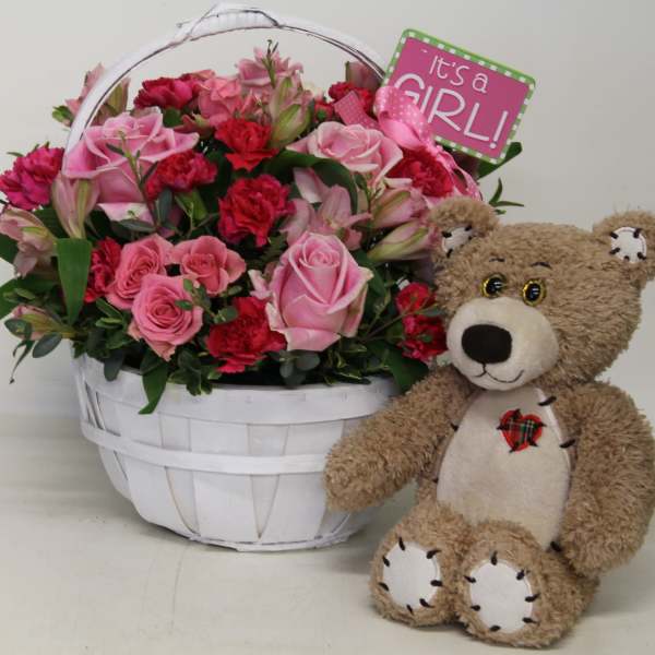 Pink rose basket with a teddy bear and "It's a GIRL!" sign