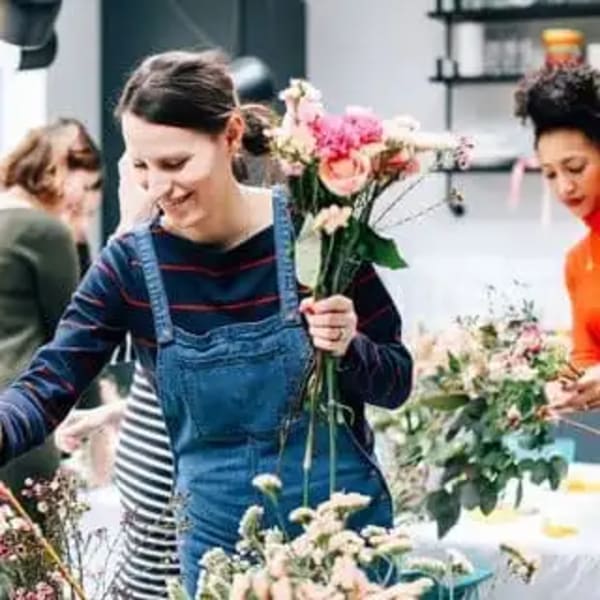 People arranging bouquets in a flower shop