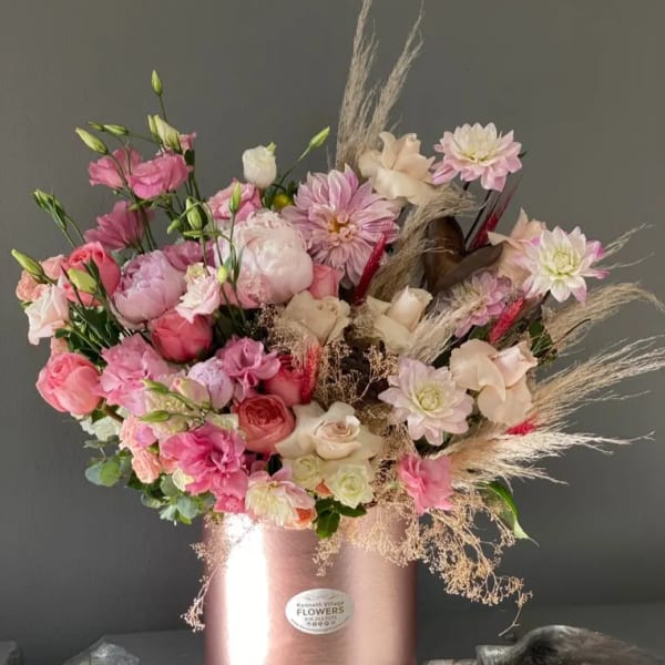 Pink and cream mixed bouquet in a rose-gold box vase