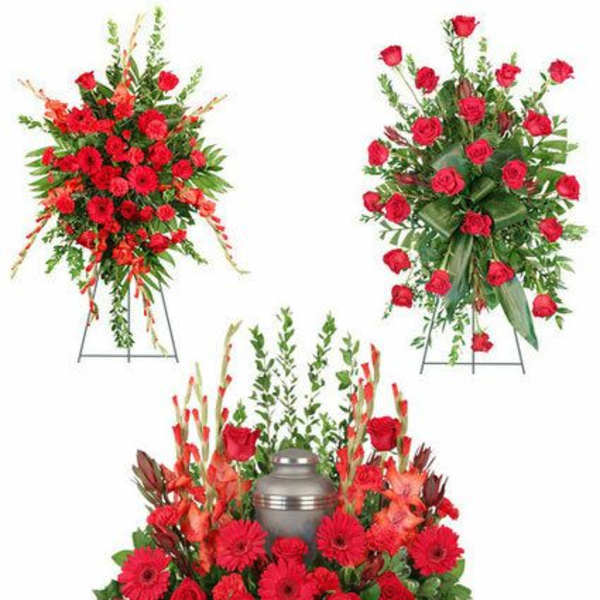 Red floral funeral arrangement with urn centerpiece and standing sprays