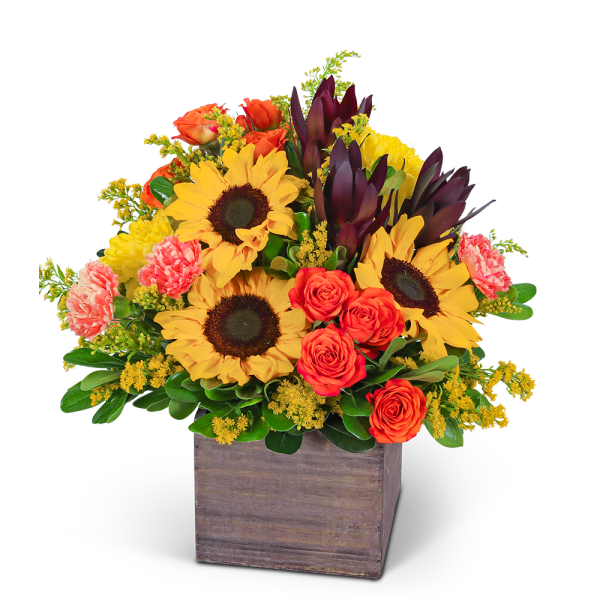 Sunflowers, orange roses, and carnations in a wooden box