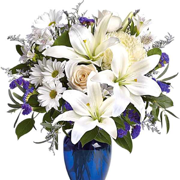 White lilies and daisies arranged in a blue vase