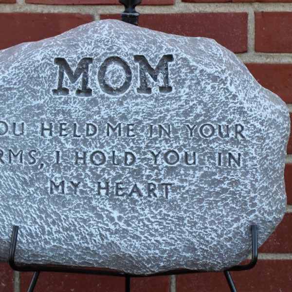 Memorial stone engraved with "MOM" and a tribute message