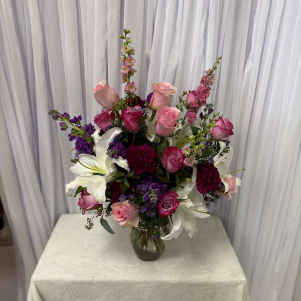 Pink and white mixed bouquet in a glass vase