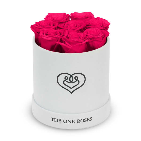 Hot pink roses arranged in a white round box