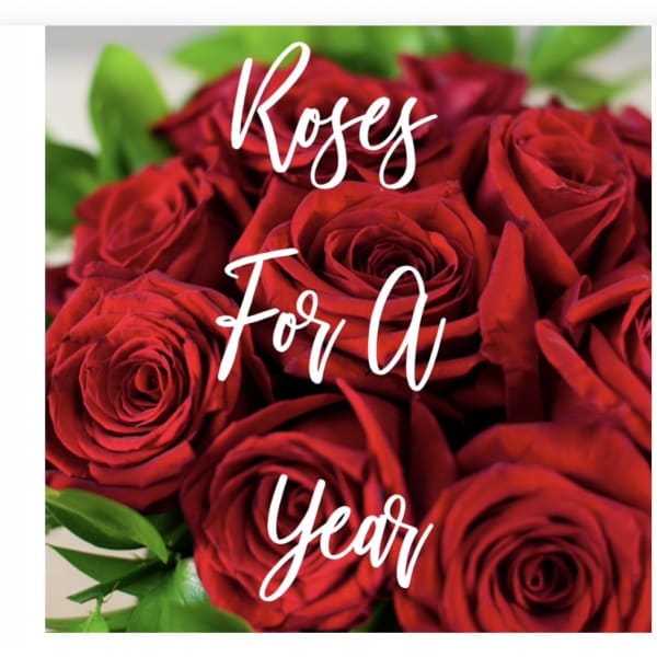 Close-up bouquet of red roses with green foliage