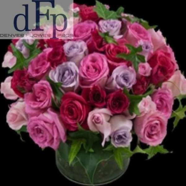 Bouquet of pink and lavender roses in a glass vase