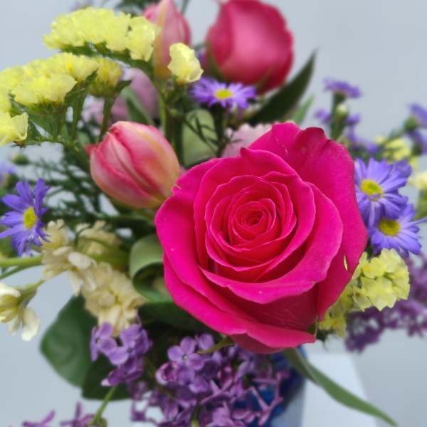 Pink rose bouquet with purple and yellow filler flowers