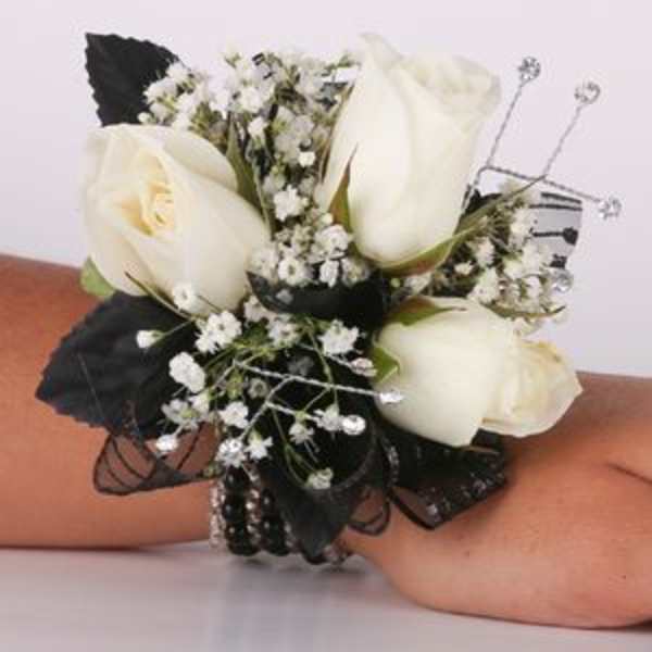 White rose wrist corsage with baby's breath and black ribbon