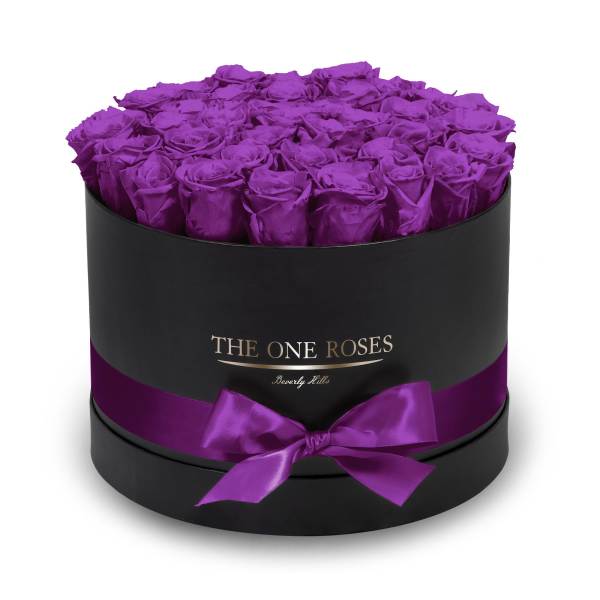 Purple roses in a black round box with a satin ribbon