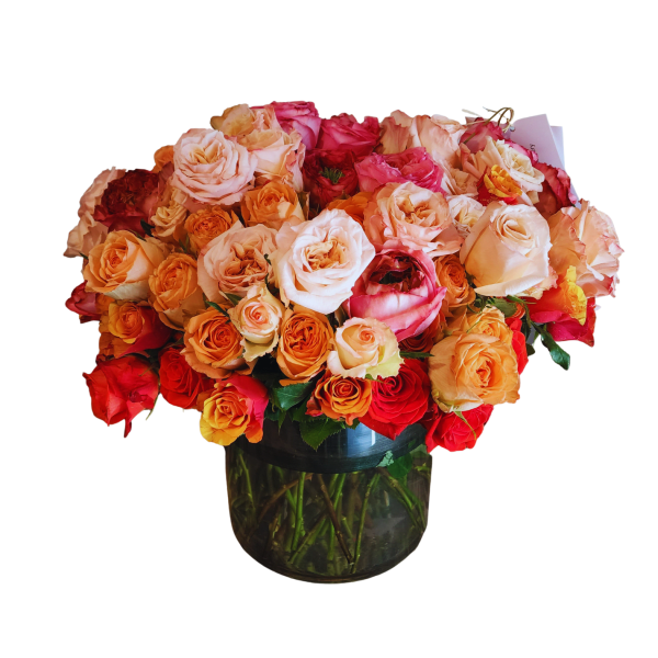 Bouquet of multicolored roses in a glass vase
