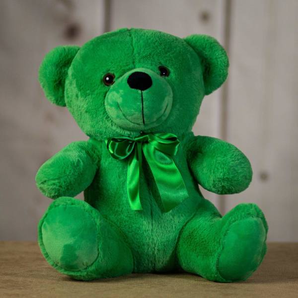Green plush teddy bear with a satin bow