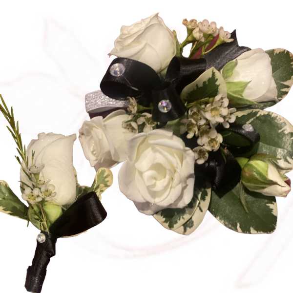 White rose boutonniere with black ribbon and variegated leaves