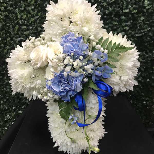 White chrysanthemum bouquet with blue carnations and ribbon