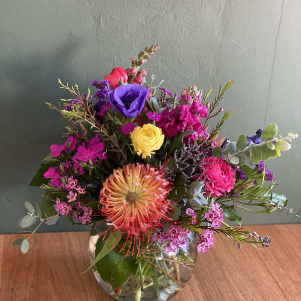 Colorful mixed bouquet in a clear glass vase