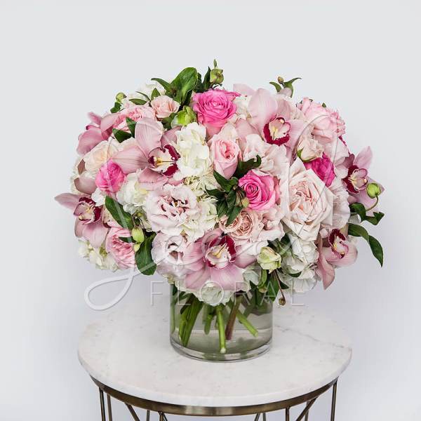 Pink and white mixed bouquet in a clear glass vase