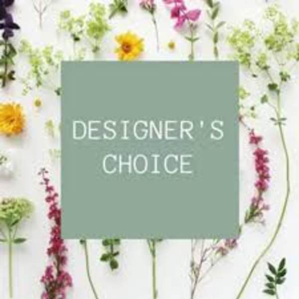 Designer’s choice floral arrangement with assorted blooms on a white background