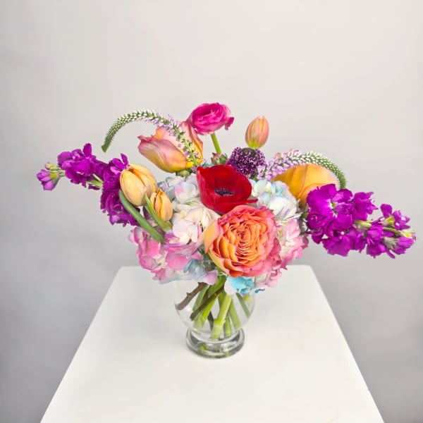 Colorful mixed bouquet in a clear glass vase