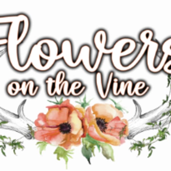 Decorative floral sign reading "Flowers on the Vine" with painted poppies and antlers