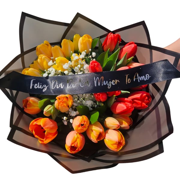Bouquet of yellow, orange, and red tulips with a black ribbon